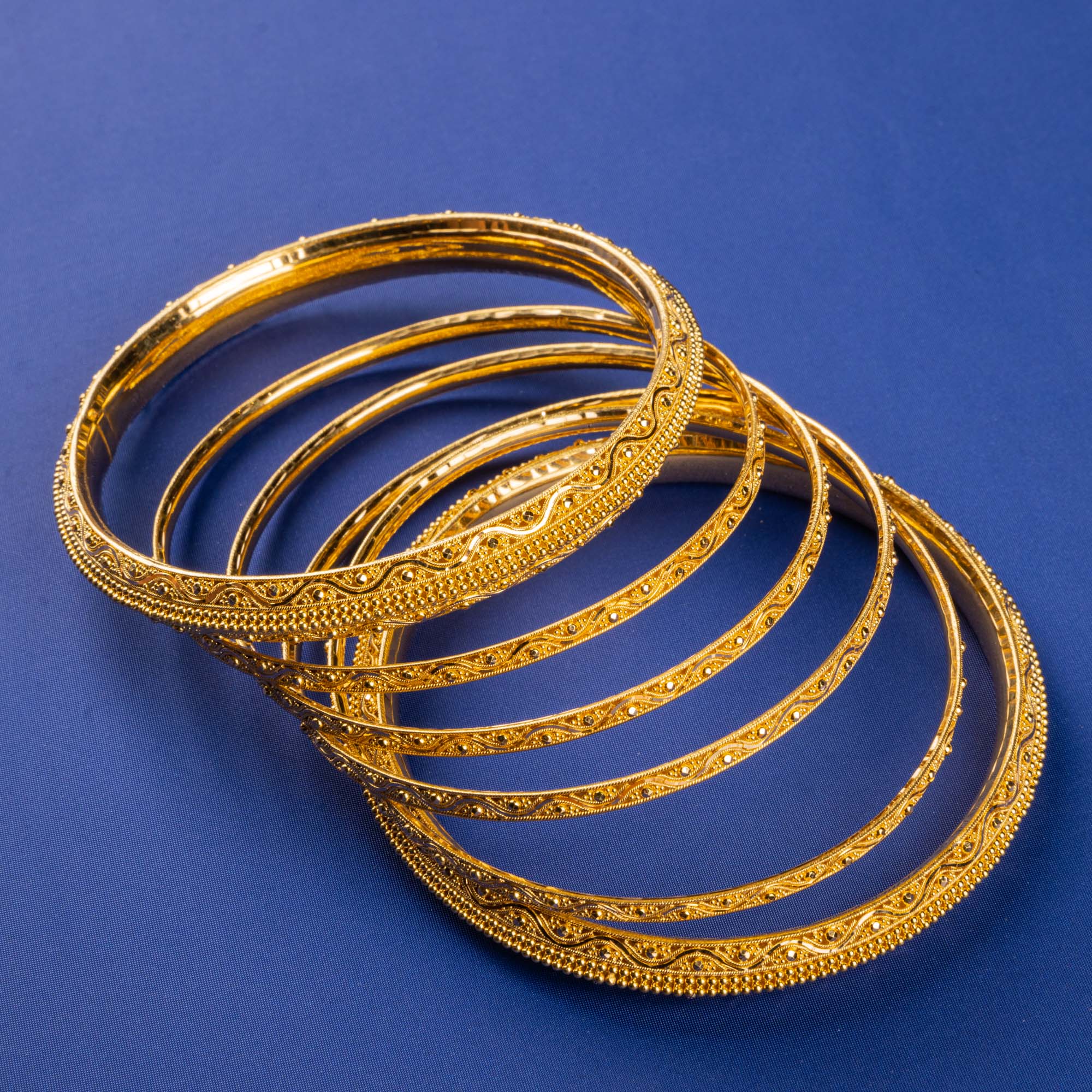 Radiant Elegance: Handmade 22K Gold Bangles with Delicate Golden Patterns